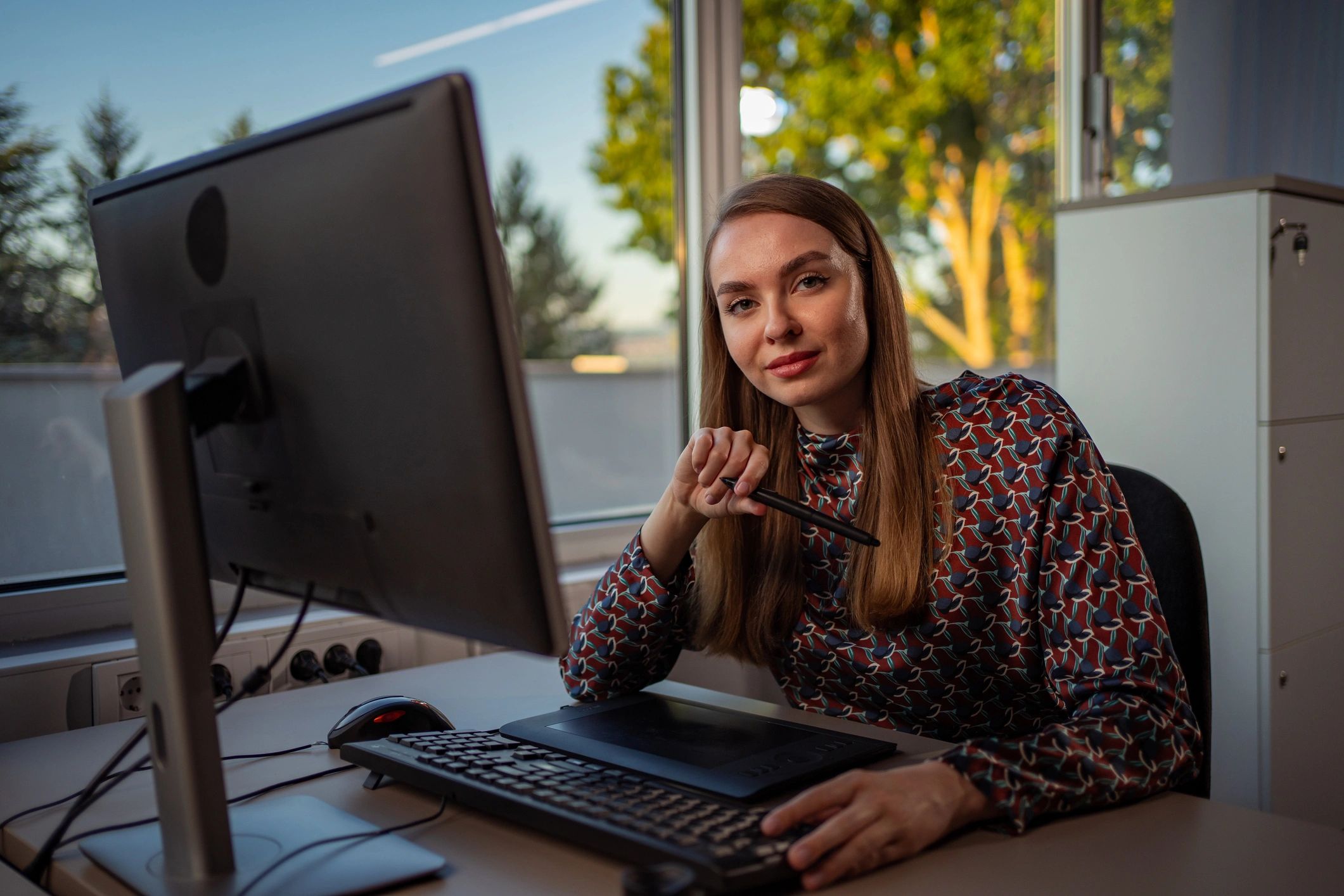 Graphic designer in office working on digital brand visuals