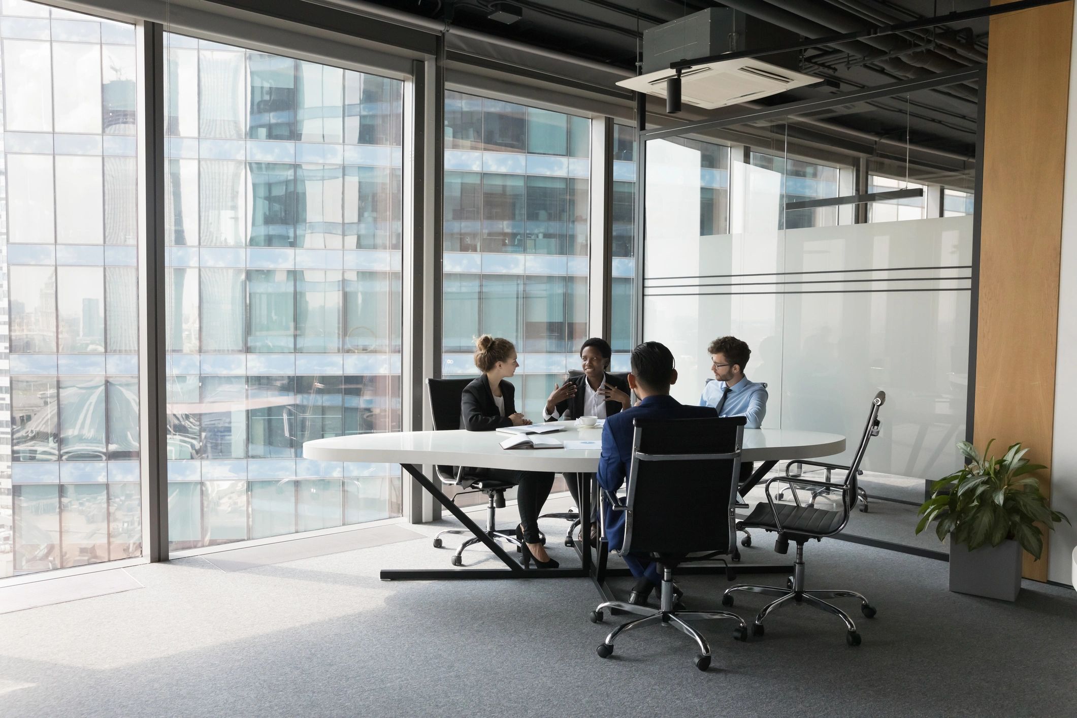 Modern business team collaborating at a meeting table