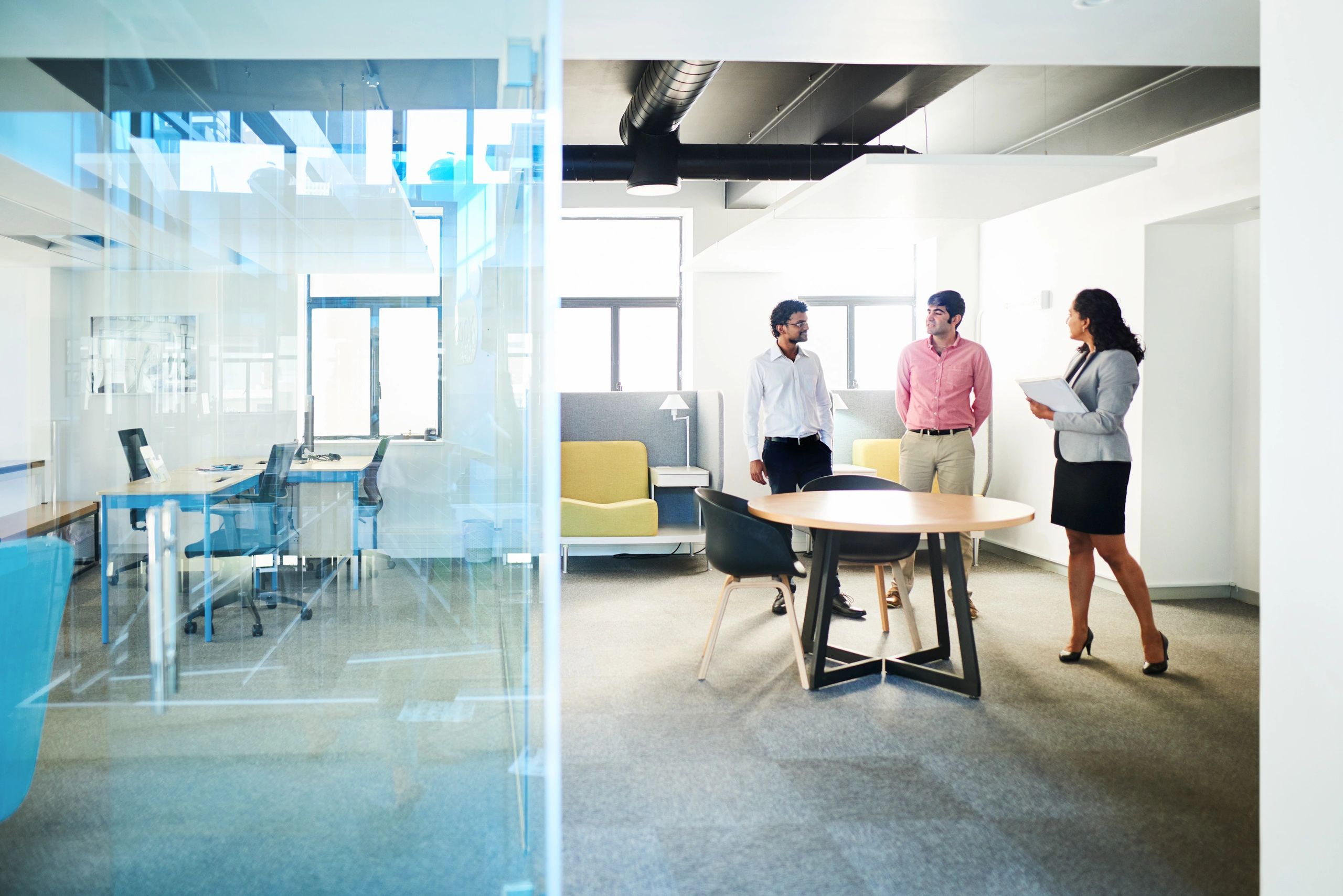 Diverse business team collaborating around an office table