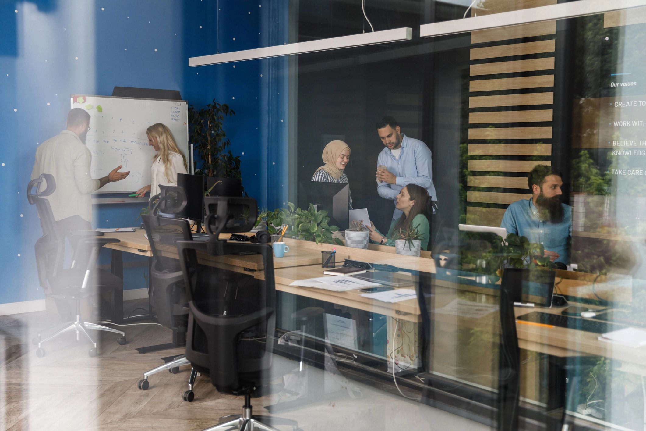 Team collaborating on strategy in a modern office