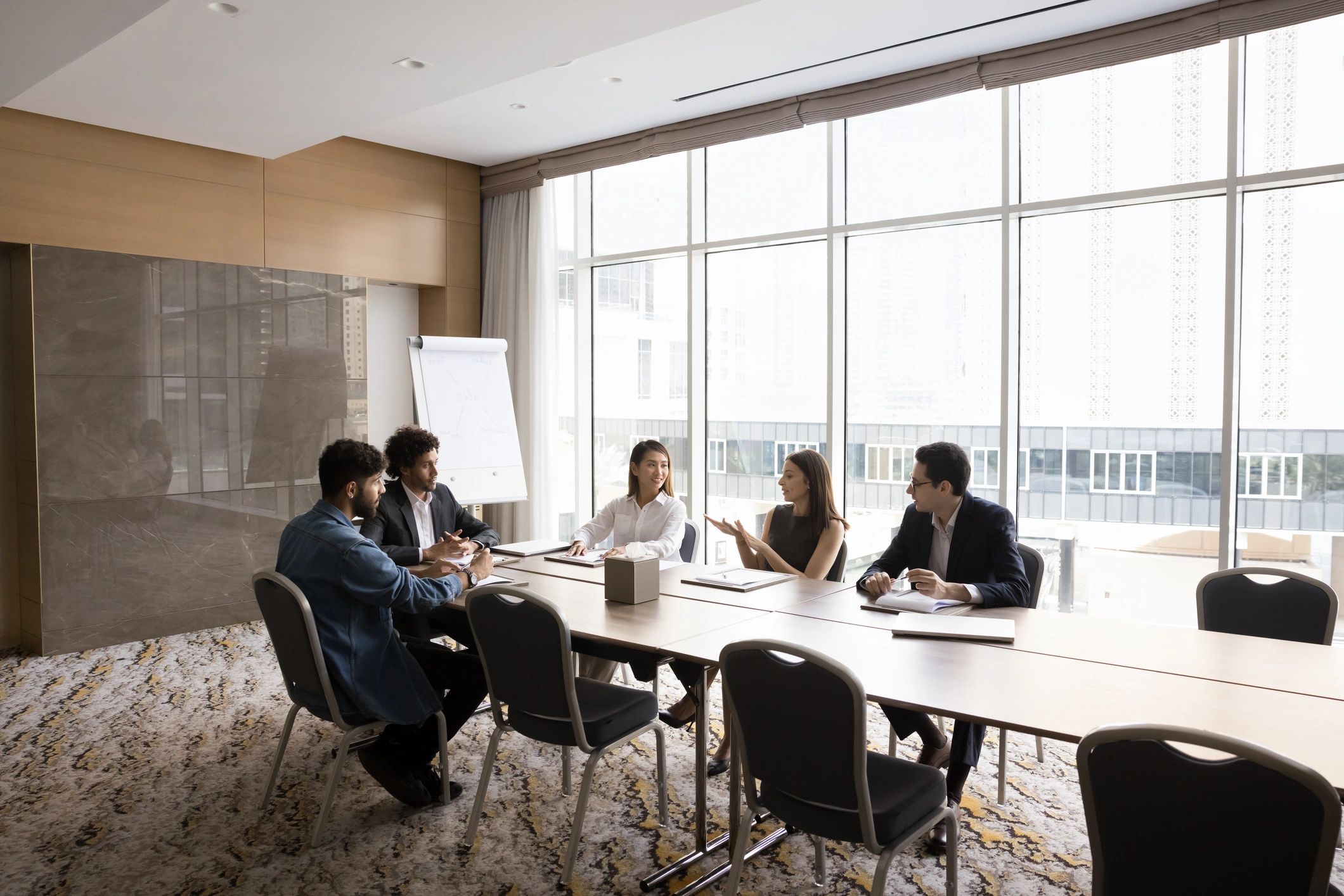 Business team collaborating in a modern technology consulting office