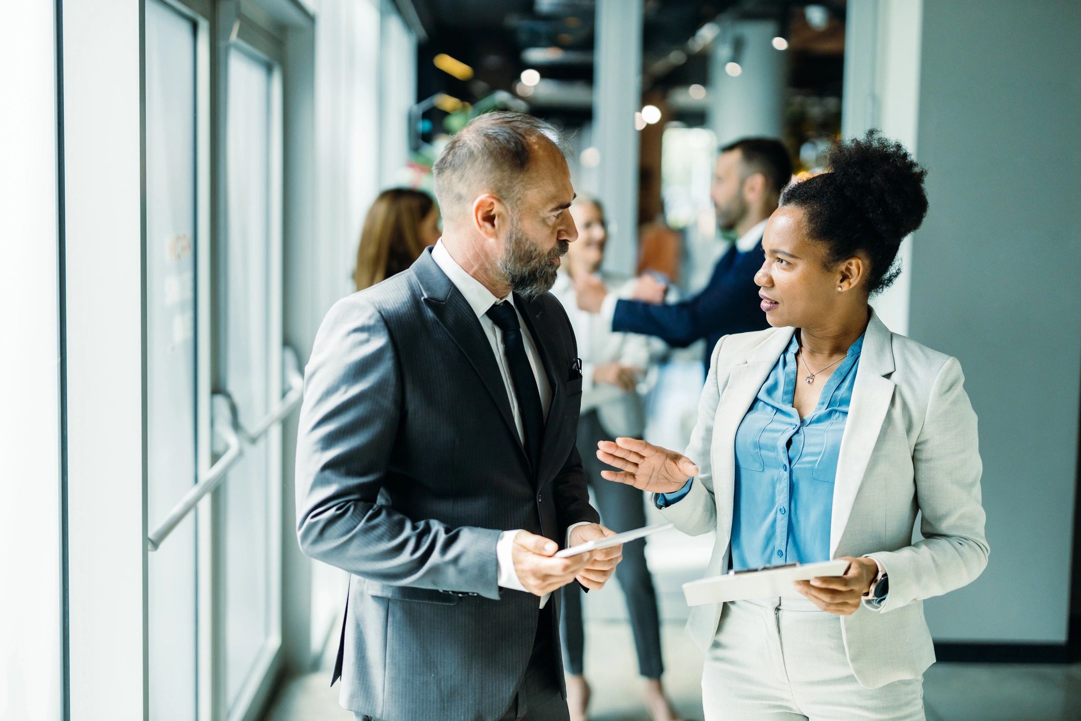 Professionals discussing strategy in a bright modern office
