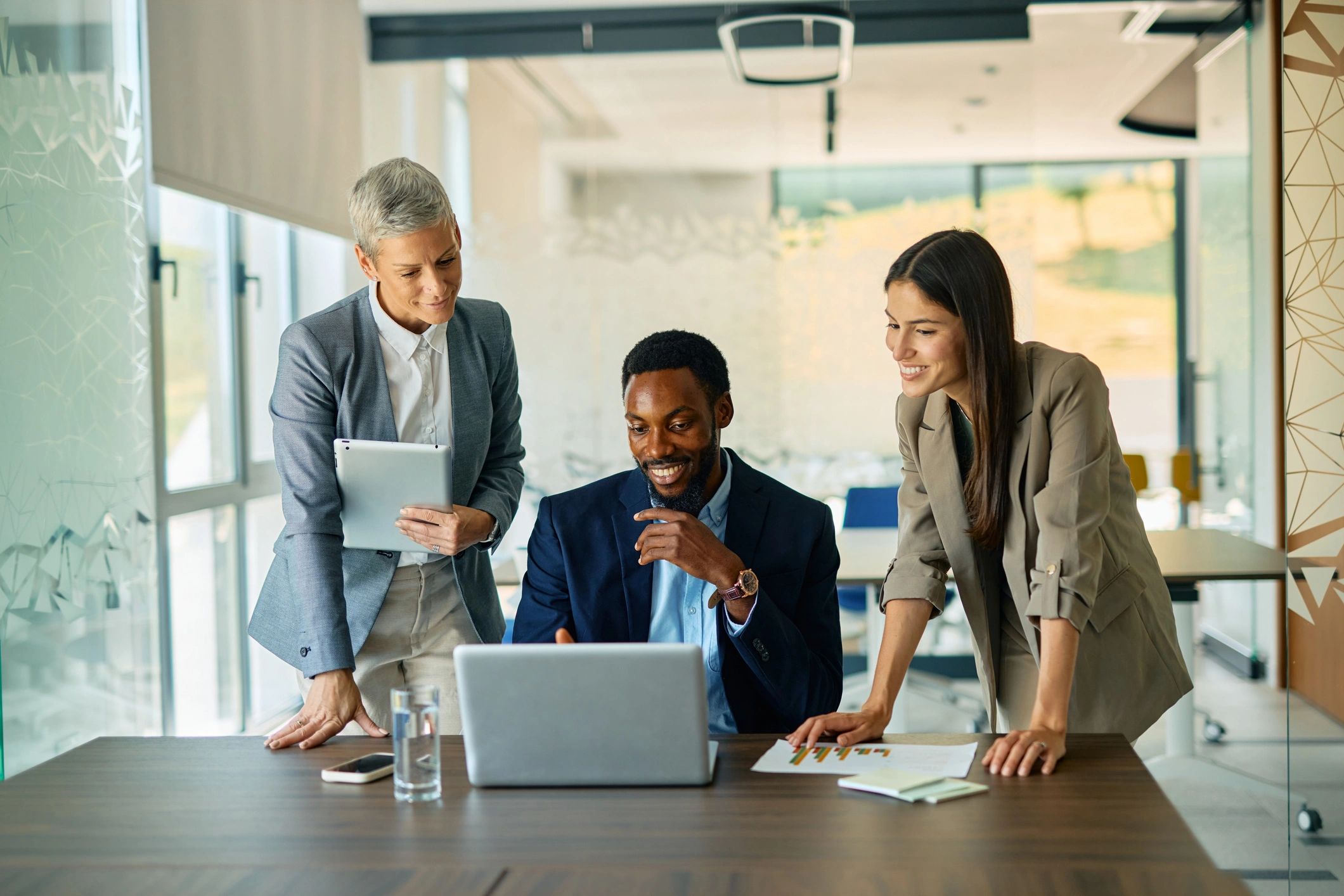 Business team collaborating with technology in a modern office
